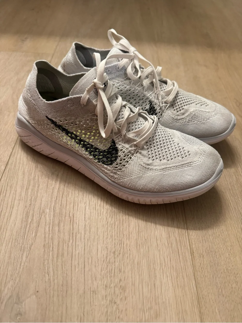 Nike Women’s White and Black Flyknit Sneakers